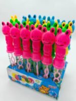 Tubo de burbujas 800414 con cabeza de rana rosa, verde, azul y amarilla en exposición, ideal para niños y juegos didácticos, fomentando la alegría y el aprendizaje.